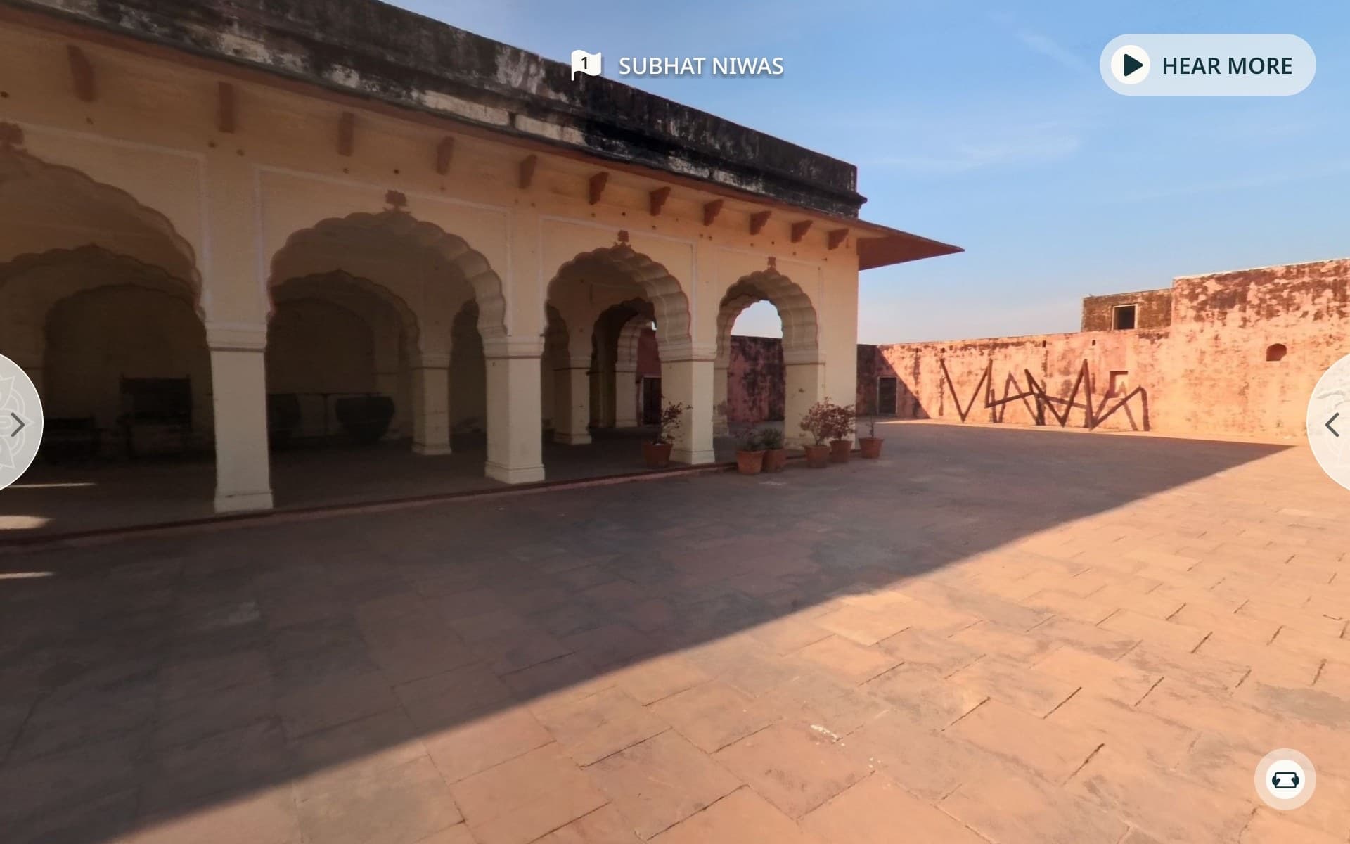 Subhat Niwas today: an empty sandstone courtyard beside a weathered arcade